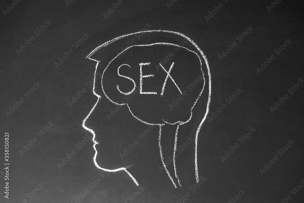 Concept man thinks about sex. Male head and the inscription sex on a chalk board.
