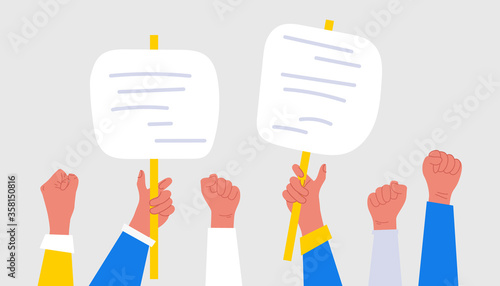 People hands holding signs, banner and placards on a protest demonstration or picket on parade, political meeting or rally. Group of male and female protesters and activists.