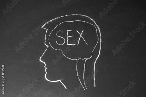 Obraz na płótnie Concept man thinks about sex. Male head and the inscription sex on a chalk board. w salonie