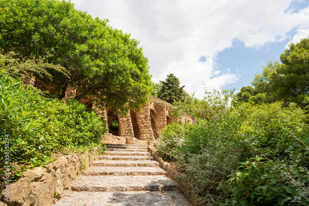 BARCELONA, CATALONIA, SPAIN - JUNE 12, 2020: The famous Parc Güell designed by the architect Gaudi. Without tourists during phase 2 of the Covid-19 deescalation in the city of Barcelona. BARCELONA, CATALONIA, SPAIN - JUNE 12, 2020: The famous Parc Güell designed by the architect Gaudi. Without tourists during phase 2 of the Covid-19 deescalation in the city of Barcelona.