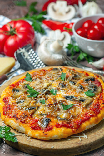 Pizza with mushrooms and cheese. Italian cuisine.