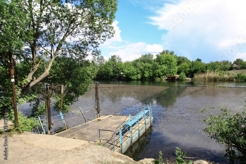 River crossing from one bank to another along a cable. Means of transportation remote from civilization. Stock photo background.