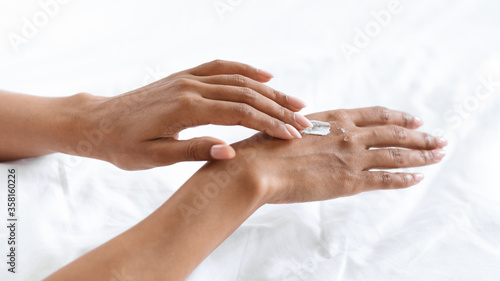 Dry Hands Prevention. Black Female Applying Cream For Skin Moisturising