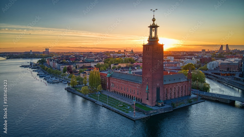 Obraz premium Rådhuset in Stockholm, Sweden by drone at sunset
