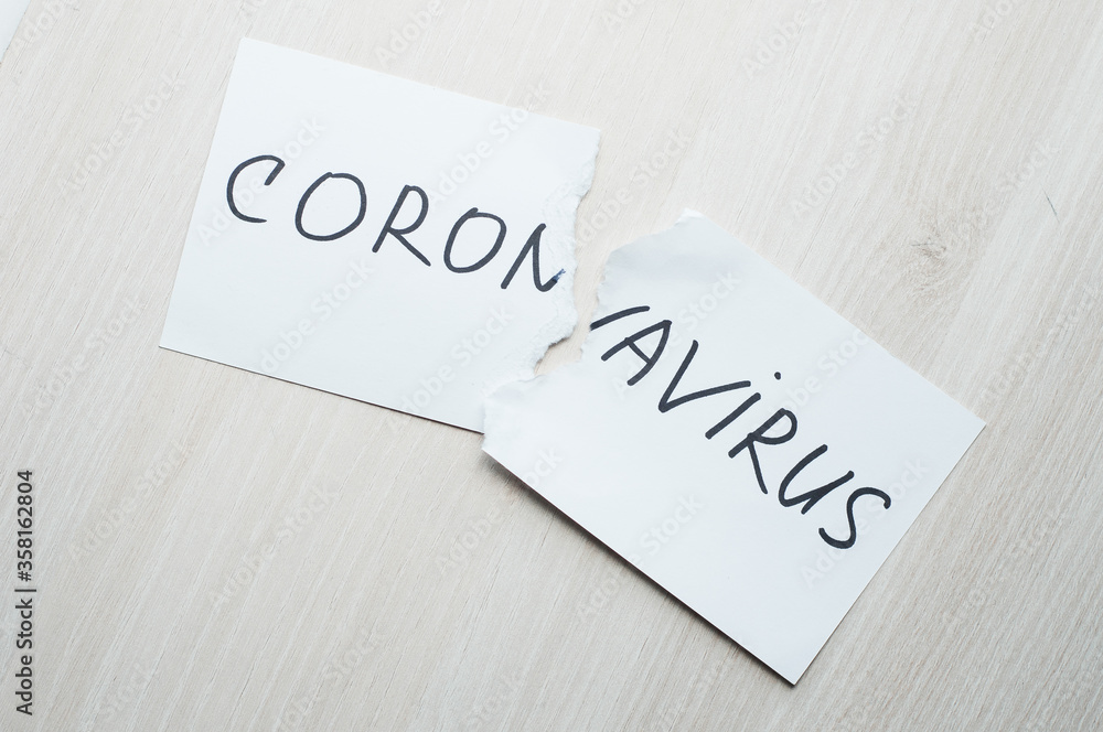 torn sheet with the inscription coronavirus. The concept of victory over coronovirus infection. torn sheet with the inscription coronavirus. The concept of victory over coronovirus infection.