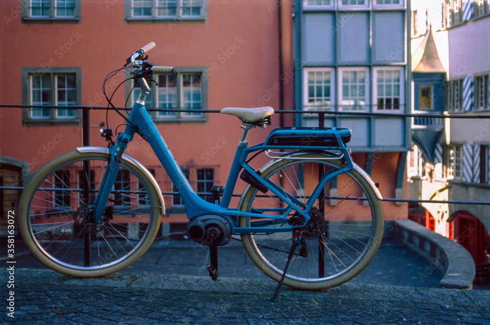 A bike standing in the emtpy Zurich old town, shot with analogue slide film technique A bike standing in the emtpy Zurich old town, shot with analogue slide film technique