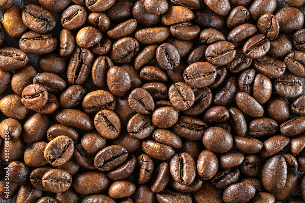 Black coffee background. Caffeine espresso beans for breakfast dark drink in cup. Cafe food. Assorted ground and instant brown roasted coffee seeds on stone. Copy space, top view Black coffee background. Caffeine espresso beans for breakfast dark drink in cup. Cafe food. Assorted ground and instant brown roasted coffee seeds on stone. Copy space, top view