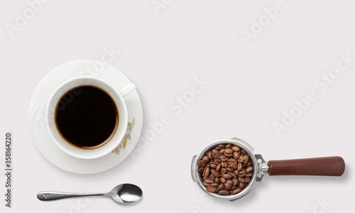 Coffee with coffee beans and spoon on a white background