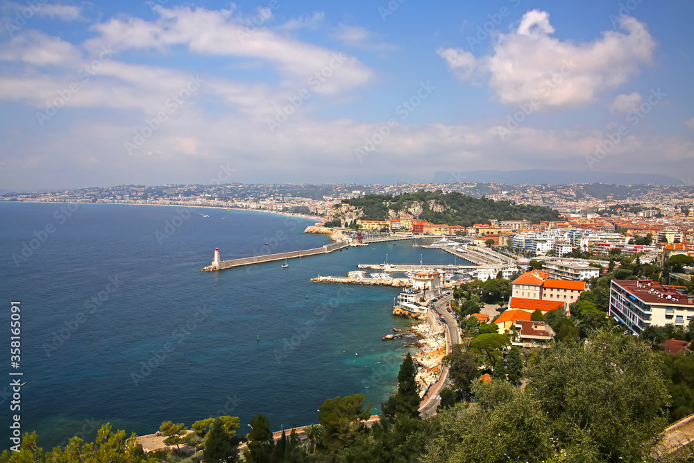 Beautiful view of Nice harbor from Mont Boron. Also you can see the Promenade des Anglais, the marina, buildings and the Mediterranean Sea, Nice, French Riviera, Provence, Côte d'Azur, France.