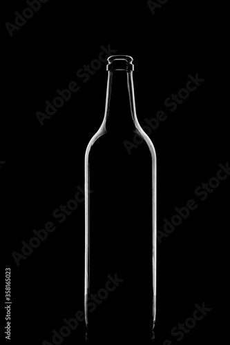 Low-key Studio Shot of a White silhouette of a bottle light glasses isolated on a black Background. Smooth lines and shapes.