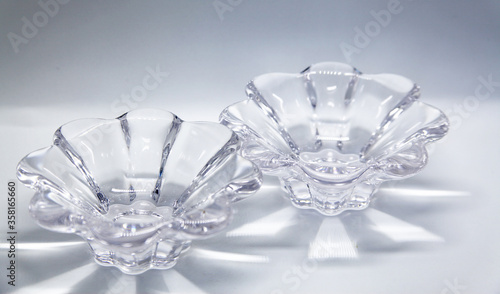 Decorative object in transparent glass, in the shape of a flower, which can be used as a candlestick, among others