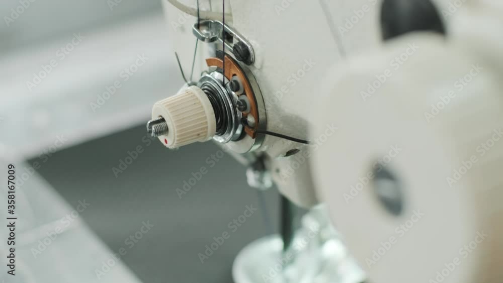 Closeup of sewing machine working part with leather. Cnc sewing machine Closeup of sewing machine working part with leather. Cnc sewing machine