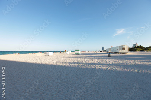 Empty South Beach, Miami, In daytime with white sand and blue skies.