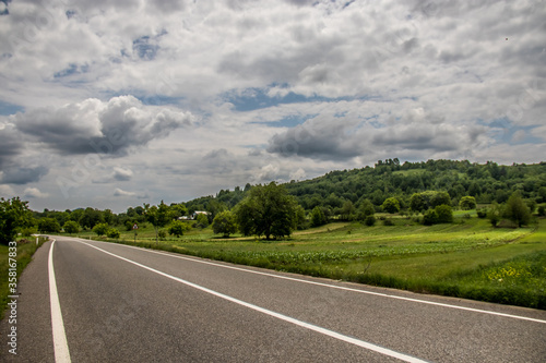 Asphalt road in countryside on sunny summer day in Vrancea region  Barsesti  Romania