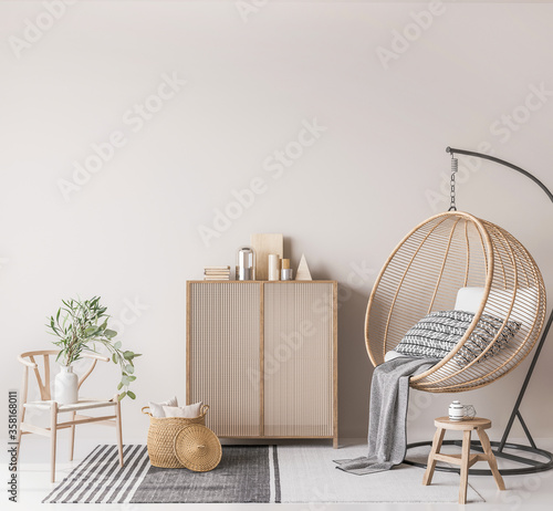 Trendy interior design for living room with natural wooden chair, basket and rattan swing with throw pillows, home decor