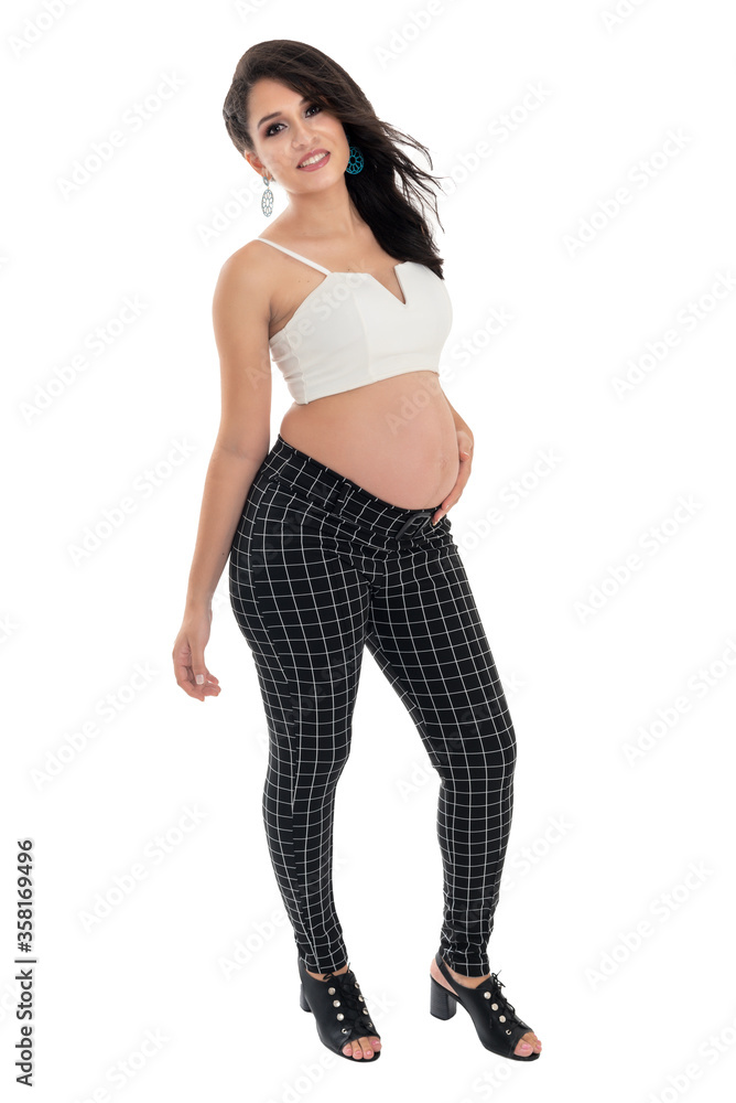Happy smiling pregnant woman touching her belly isolated on white background. Pregnancy concept studio portrait Mother expecting baby. Baby tea. Happy smiling pregnant woman touching her belly isolated on white background. Pregnancy concept studio portrait Mother expecting baby. Baby tea.