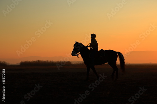 Silhouette view of a horseman at sunset. Cappadocia, Turkey