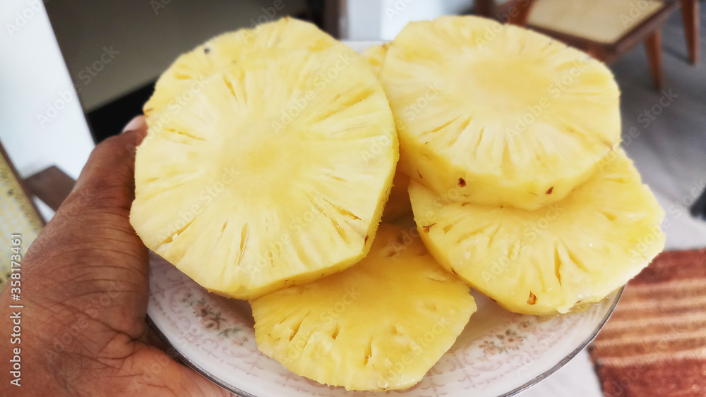 Slices of Pineapple on the serving plate. Delicious pineapple fruit plate. Slices of Pineapple on the serving plate. Delicious pineapple fruit plate.
