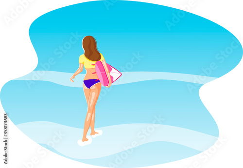 Aganist the blue ocean a beautiful girl with a surfboard is about to swim