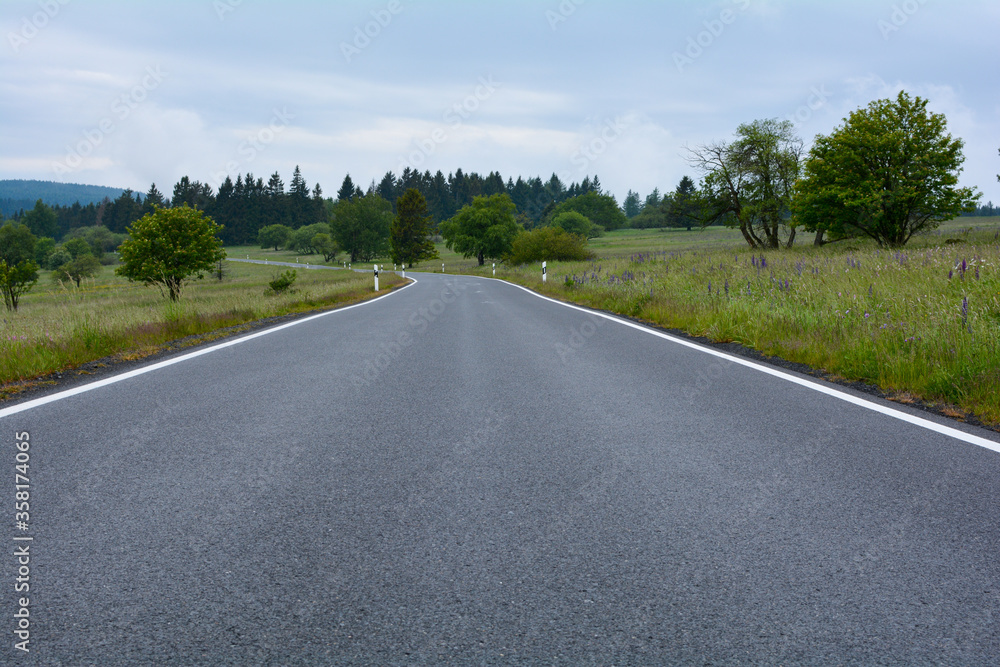 Country road between  nature and with sky