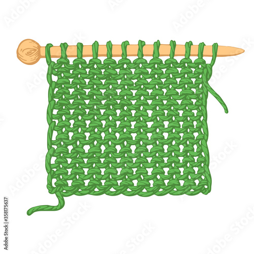 A piece of fabric knitted on knitting needles on a white background.