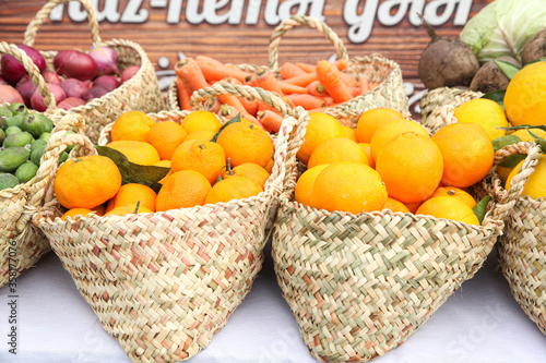 Orange baskets with other vegetables in the grocery