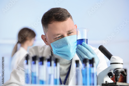 Scientist working with samp...