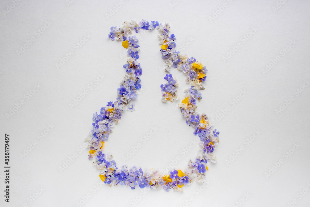 Abstract with blue flowers and yellow petals on a white background. Postcard for the holiday. Nature. Abstract with blue flowers and yellow petals on a white background. Postcard for the holiday. Nature.