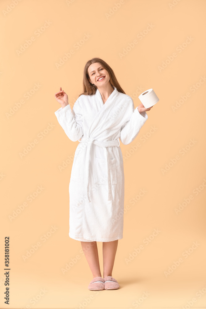 Young woman with toilet paper on color background Young woman with toilet paper on color background