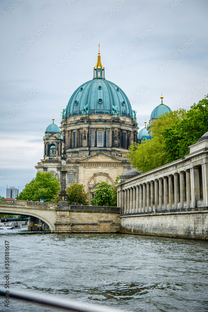Tourist boat on the river Spree at the cathedral of Berlin, Germany