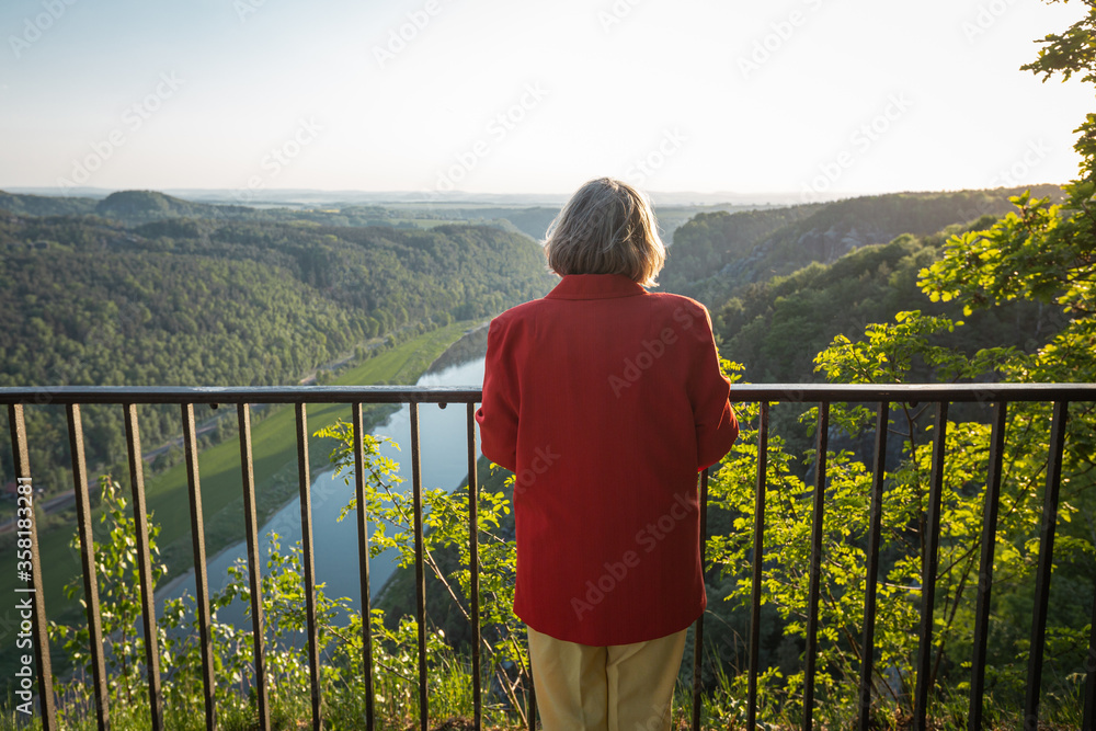 Rear view of senior woman looking over the Elbe valley