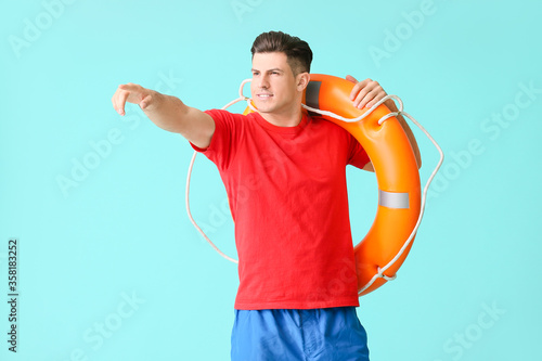 Beach rescuer with lifebuoy...