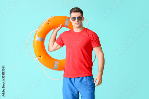 Beach rescuer with lifebuoy...