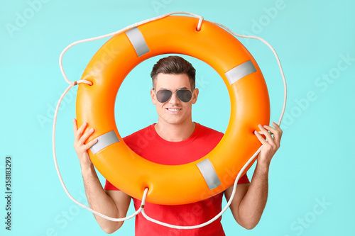 Beach rescuer with lifebuoy...