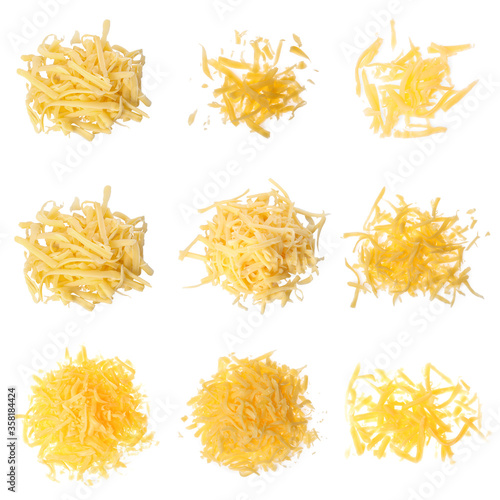 Set with grated cheese on white background, top view