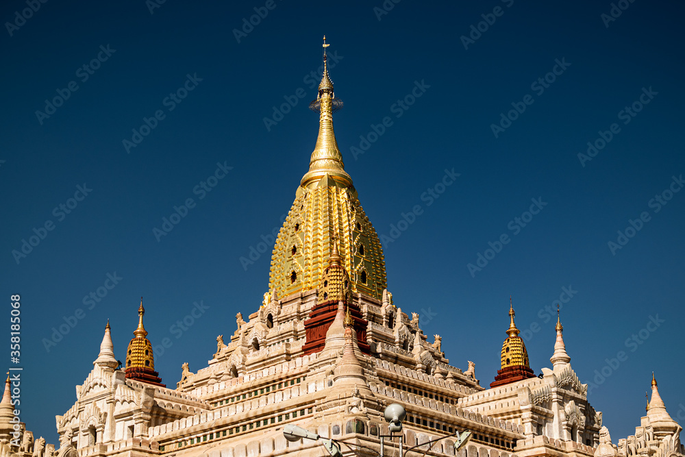 Ananda Buddhist Temple roof against deep blue sky. The temple was built by King Kyansittha in 1105 against deep blue sky. Bagan archaeological zone, Burma (Myanmar).