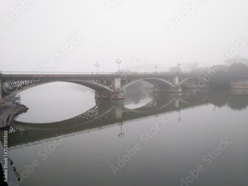 The river Guadalquivir as seen from Triana in a foggy day