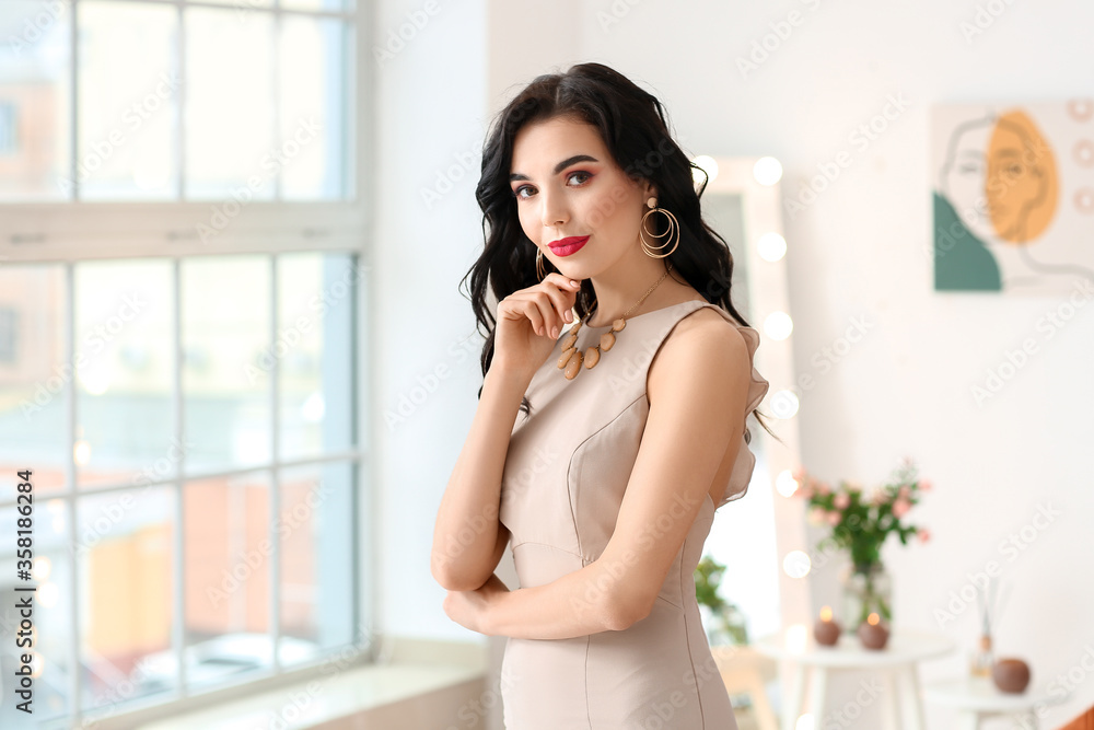 Beautiful young woman wearing stylish jewelry indoors Beautiful young woman wearing stylish jewelry indoors