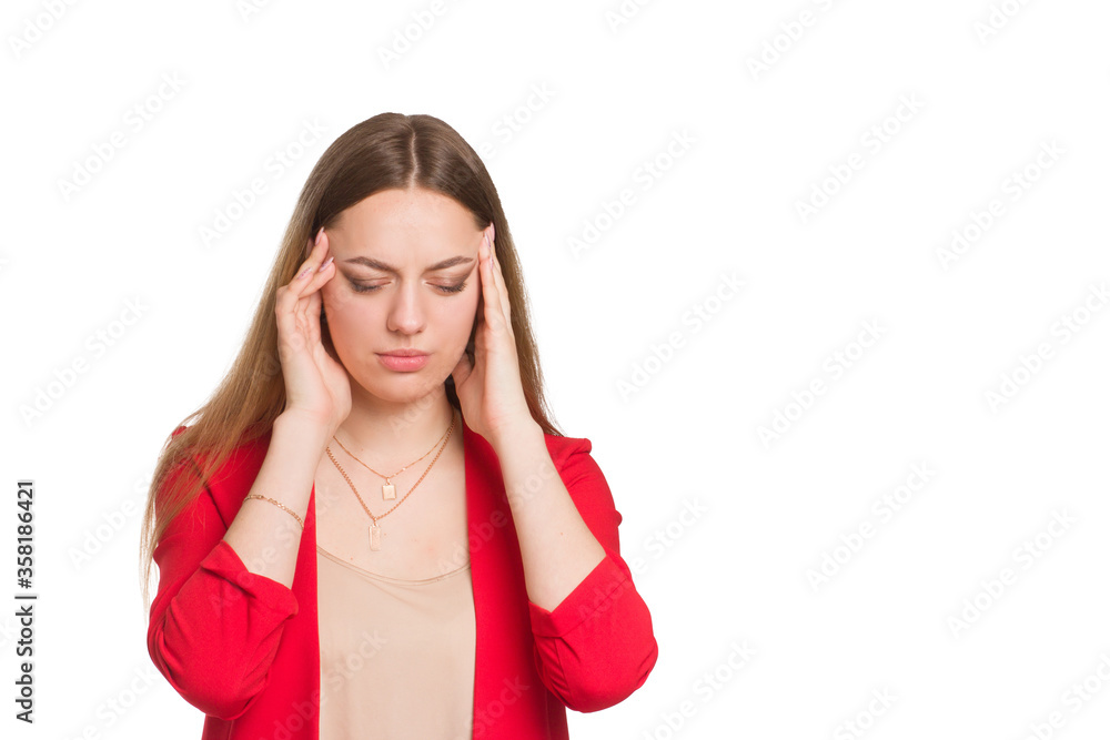 A young business woman, keeps his hands on his head. suffers from a headache A young business woman, keeps his hands on his head. suffers from a headache