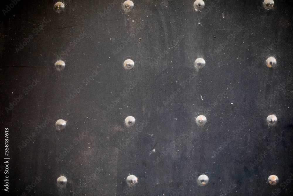 grange black metal texture with rivets and simmetric bottoms - obrazy, fototapety, plakaty 