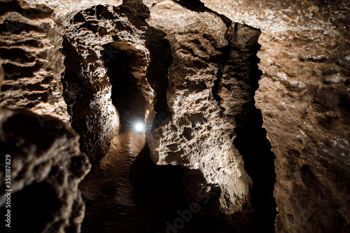 Dark Tunnel Cave has nobody. Tourist route, tours, adventures and interesting places. inside ancient crystal formations, stones, geology, explore of rocks of the soil. village Mlynky . Ukraine photo