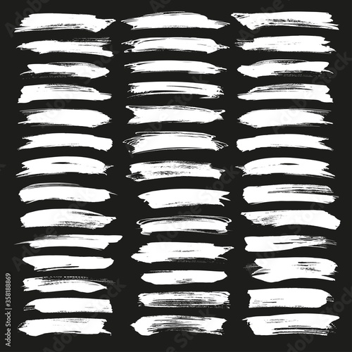 Abstract chalk white vector brush strokes set. Chalk grunge brushes. Grunge illustrator vector brush white on black background