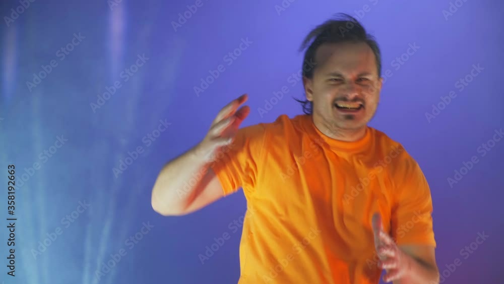 Crazy funny man dancing on the studio , very pleased, winning concept. Crazy funny man dancing on the studio , very pleased, winning concept.