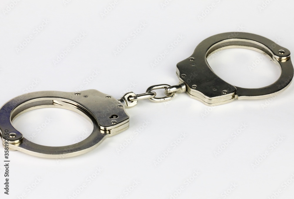 A pair of Handcuff restraints A pair of Handcuff restraints