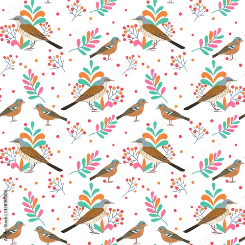 Seamless pattern with thrush birds and branches with berries. Vector illustration.