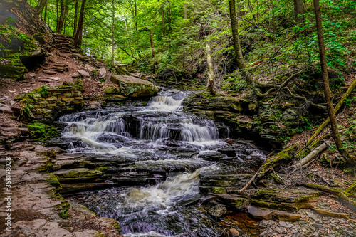 Beautiful landscape image of nature and a waterfall at Rickett s Glen State Park in Pennsylvania.