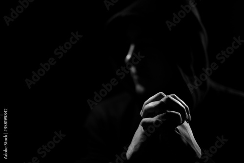 Obraz na plátne Low key photography, crossed hands of a raper
