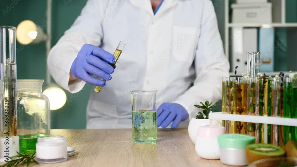 Cosmetologist preparing natural cosmetics in laboratory, closeup Cosmetologist preparing natural cosmetics in laboratory, closeup