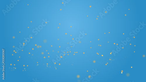 Shimmering particles with bokeh over blue background.