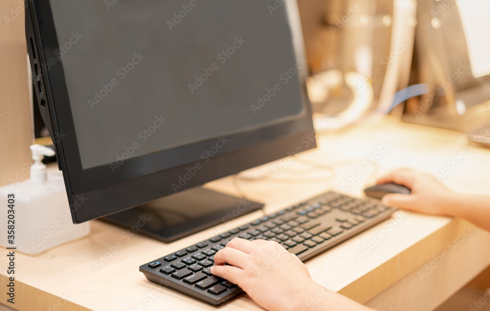 Female hand typing on the keyboard of Laptop in the concept work from home while the Coronavirus (COVID-19) epidemic crisis, social distancing for protection from virus. Female hand typing on the keyboard of Laptop in the concept work from home while the Coronavirus (COVID-19) epidemic crisis, social distancing for protection from virus.